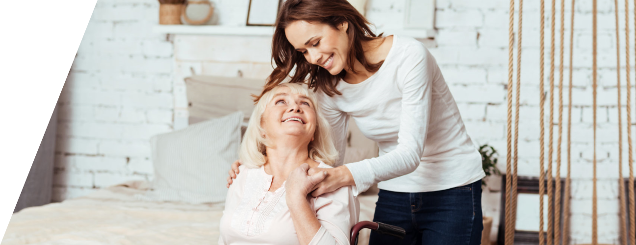 caregiver and elderly woman looking at each other