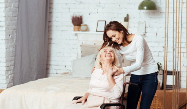 caregiver and elderly woman looking at each other